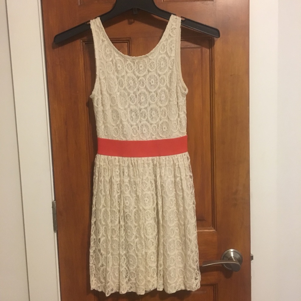White lace dress with cinched waist and open back